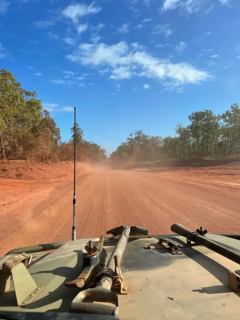 Driving on a dust Australian outback road
