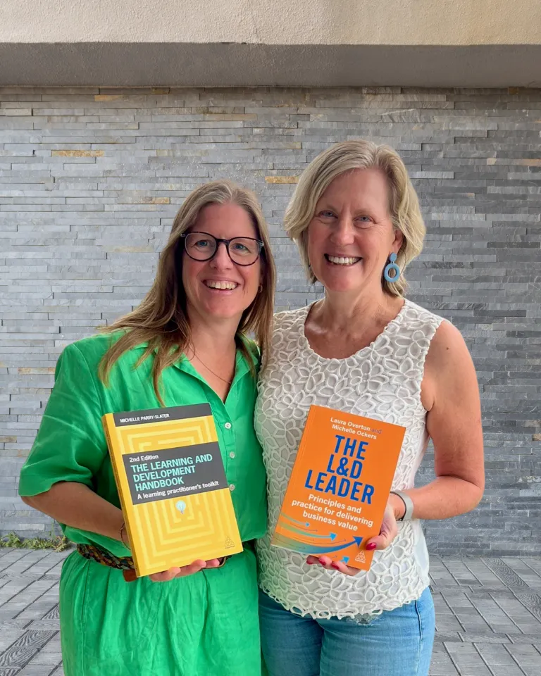 Michelle Ockers and Michelle Perry-Slater holding their books